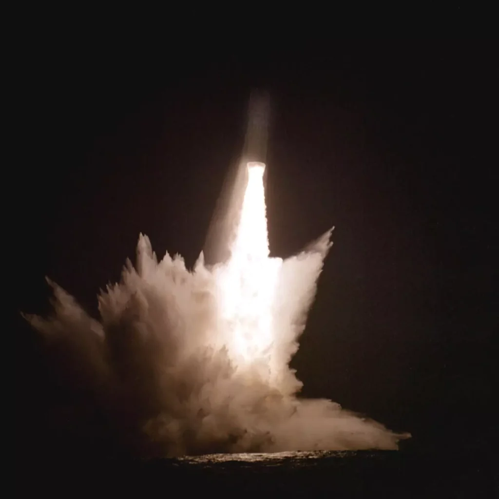 A night view of a Trident I (C4) missile launch from USS DANIEL BOONE (SSBN 629) on July 21, 1980.