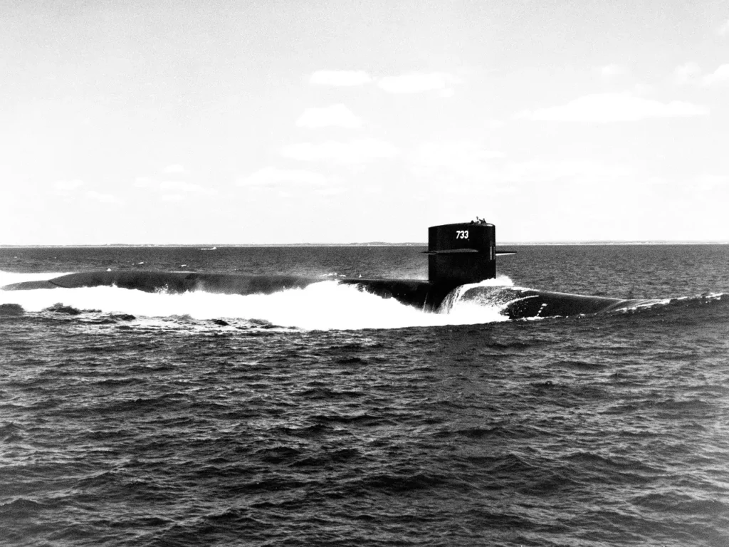 A starboard bow view of USS NEVADA (SSBN 733) underway. She was the eighth Trident submarine and the last to carry Trident I (C4) missiles.